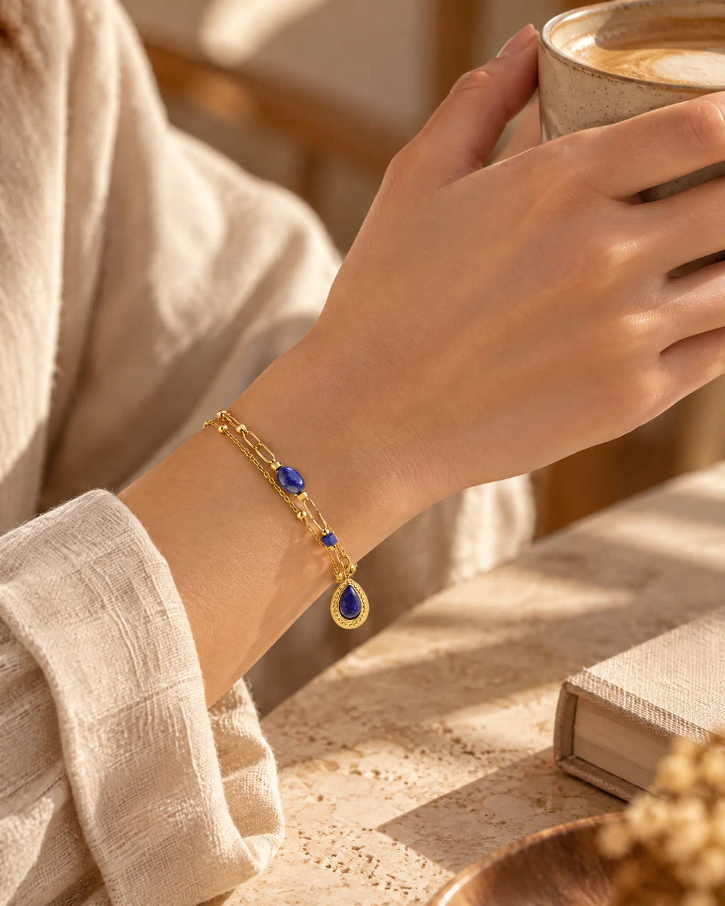 Lifestyle morning coffee setting with Midnight Teardrop Layered Bracelet