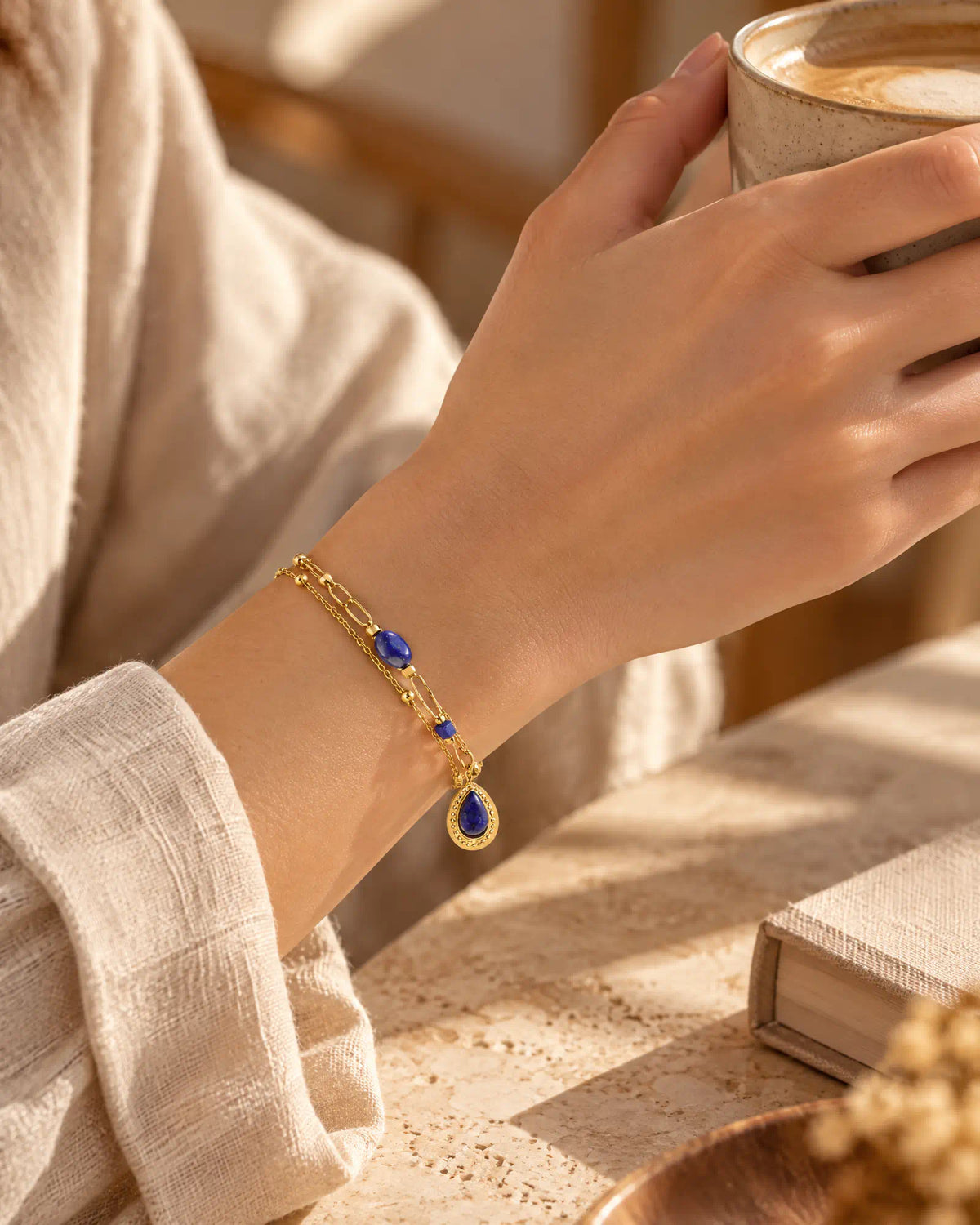 Lifestyle morning coffee setting with Midnight Teardrop Layered Bracelet