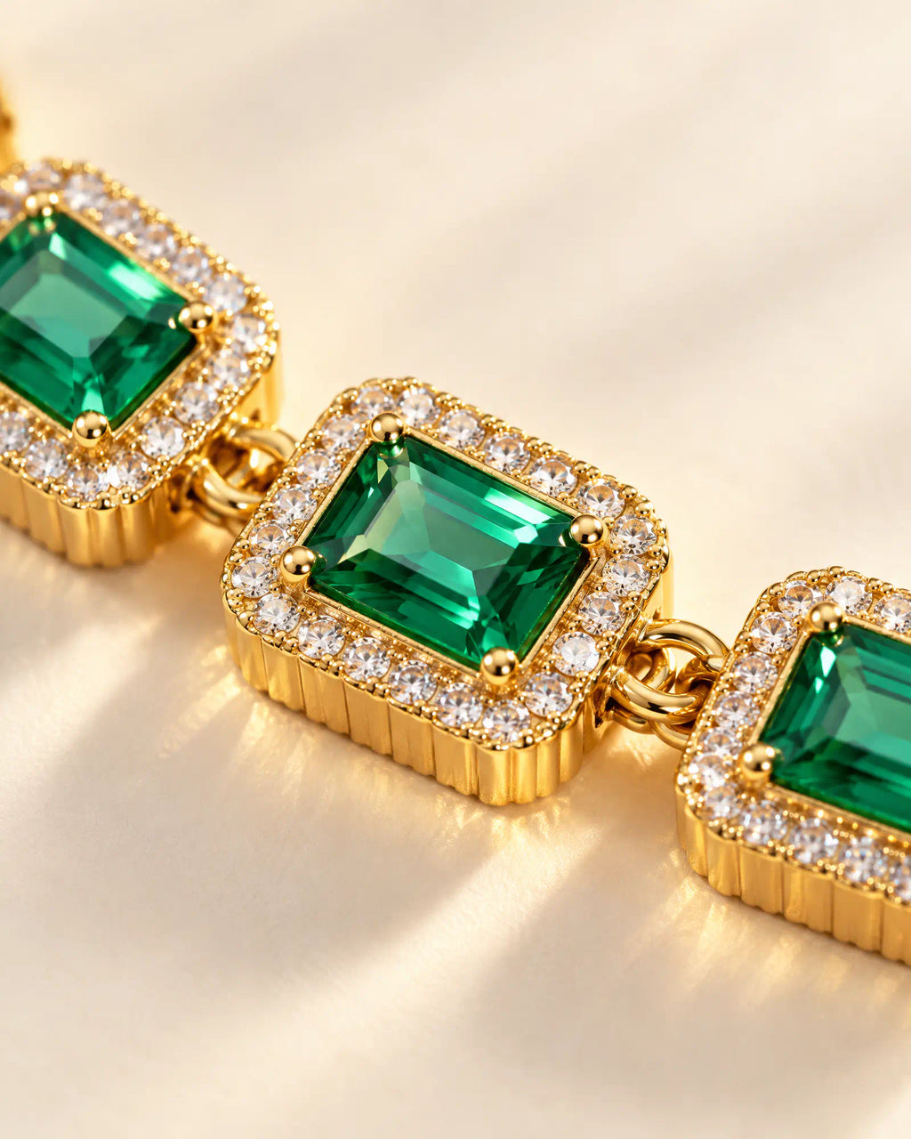 Close-up detail of Verdant Cadence Tennis Bracelet faceted green accents and fluted borders