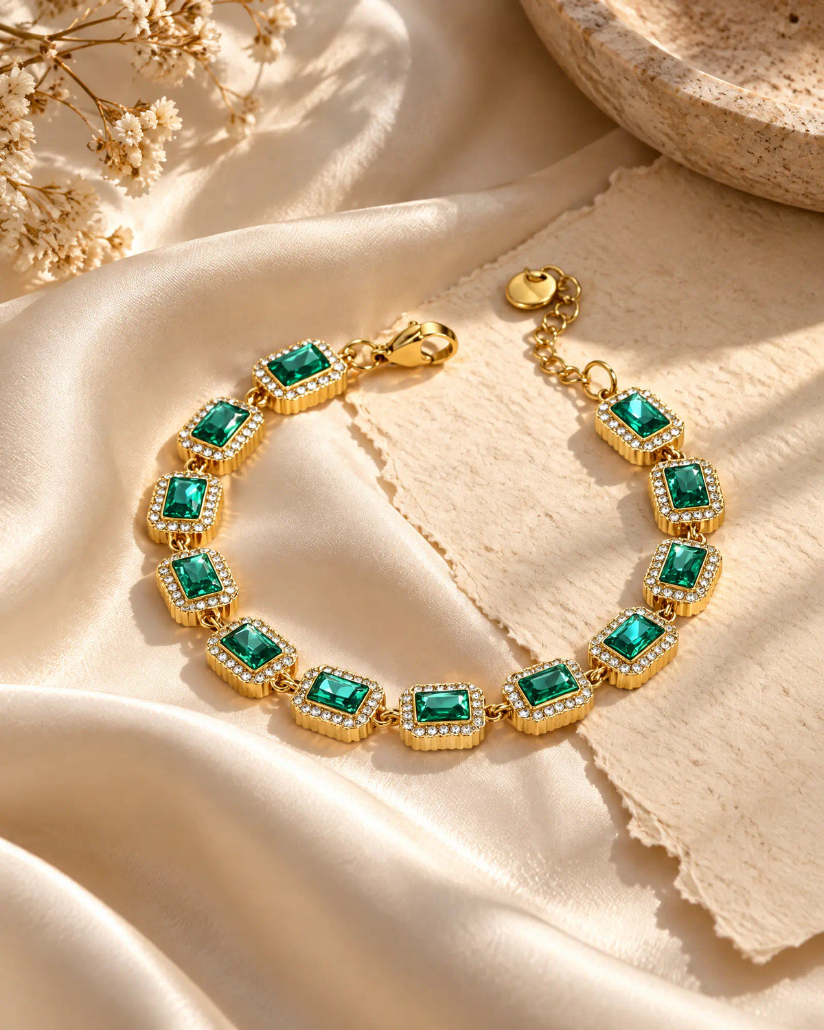 Verdant Cadence Tennis Bracelet arranged on ivory silk