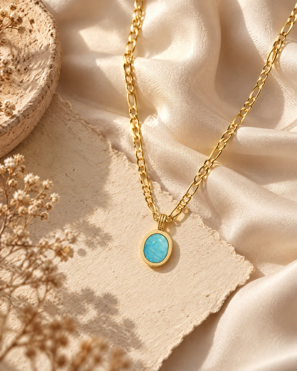Shoreline Oval Figaro Pendant Necklace on silk fabric backdrop