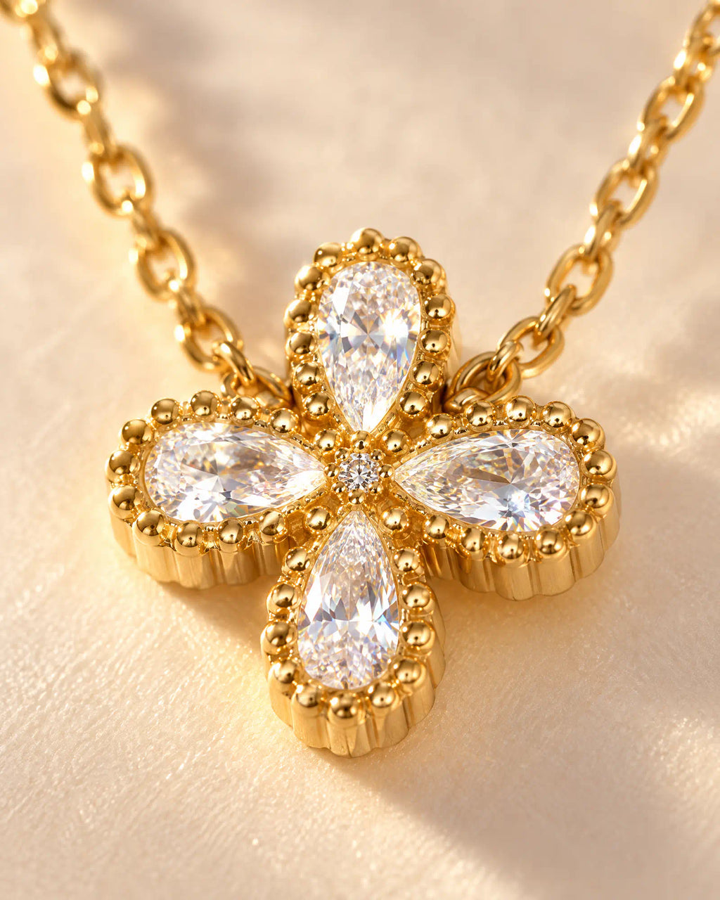 Wearlumi Four Petal Beaded Clover Pendant Necklace macro detail showing beaded bezel and faceted stones