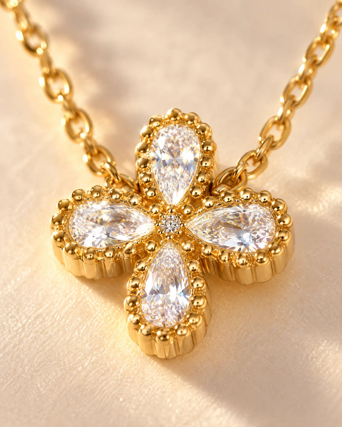 Wearlumi Four Petal Beaded Clover Pendant Necklace macro detail showing beaded bezel and faceted stones