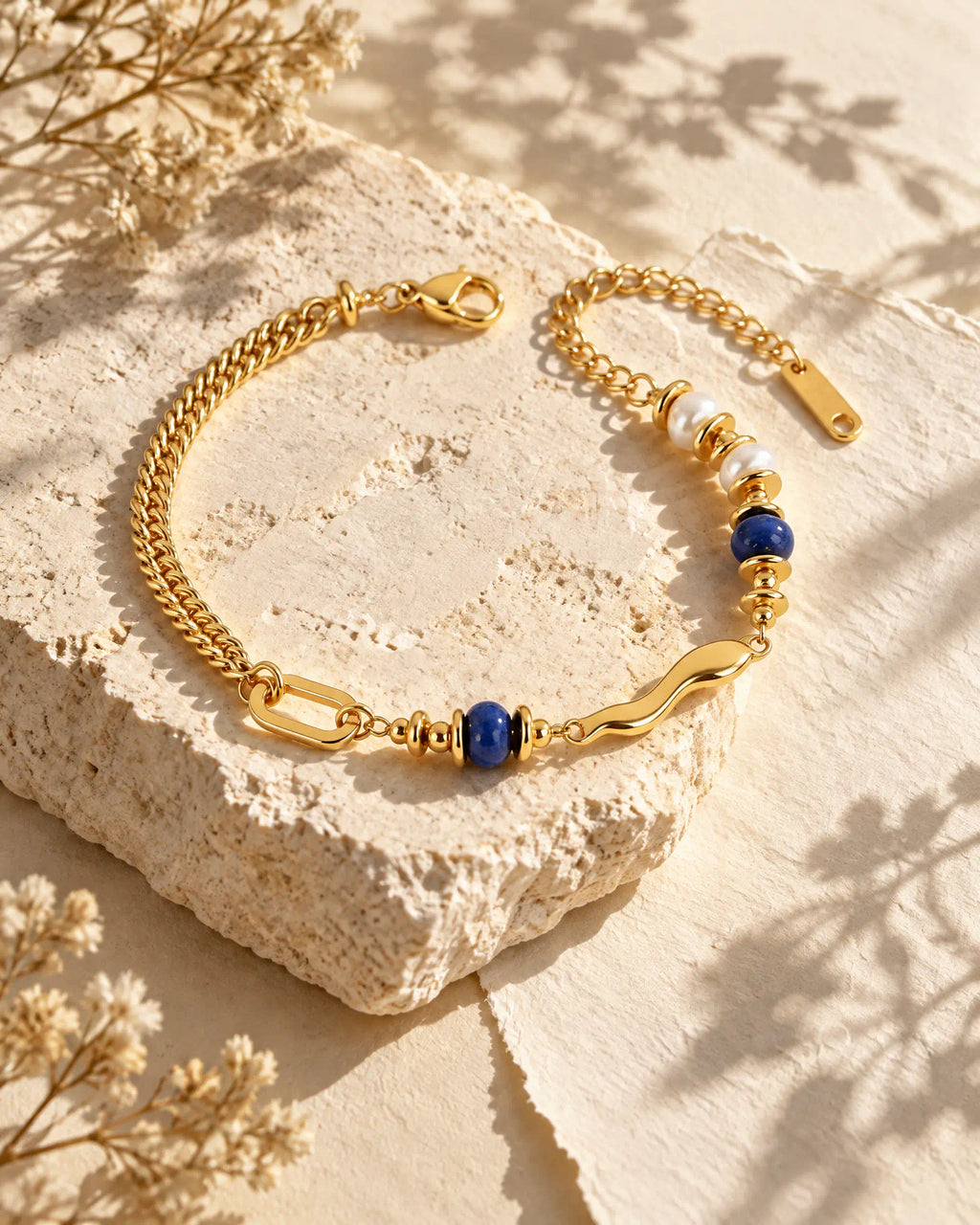 Fluid Wave Asymmetric Bracelet displayed on natural limestone stone