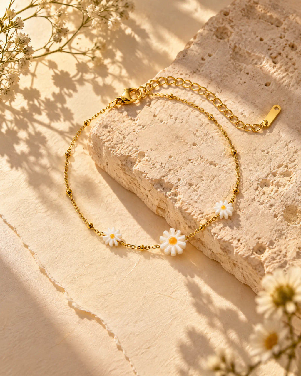 Sunlit Daisy Station Bracelet displayed on natural limestone slab