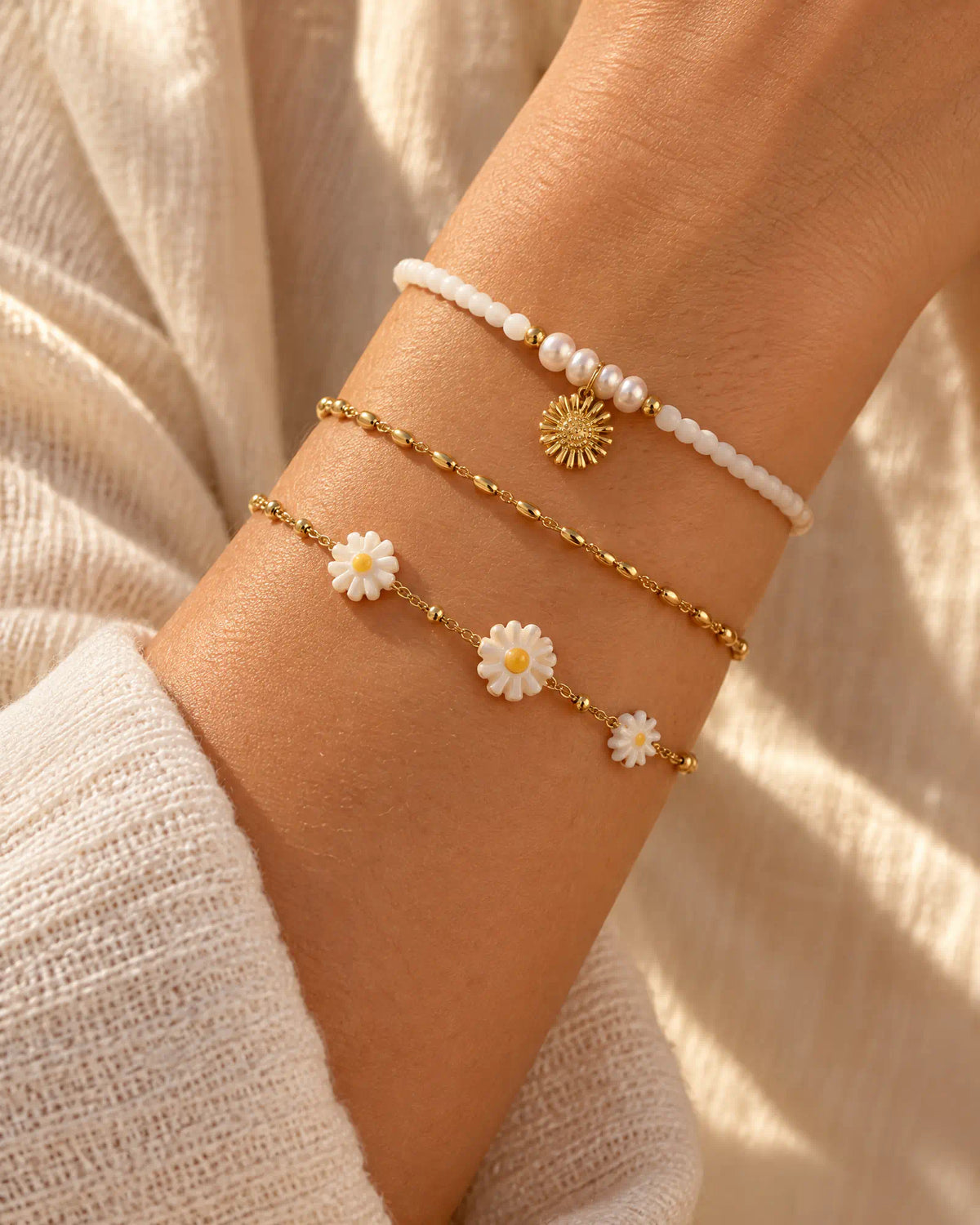 Sunlit Daisy Station Bracelet styled in a delicate wrist stack