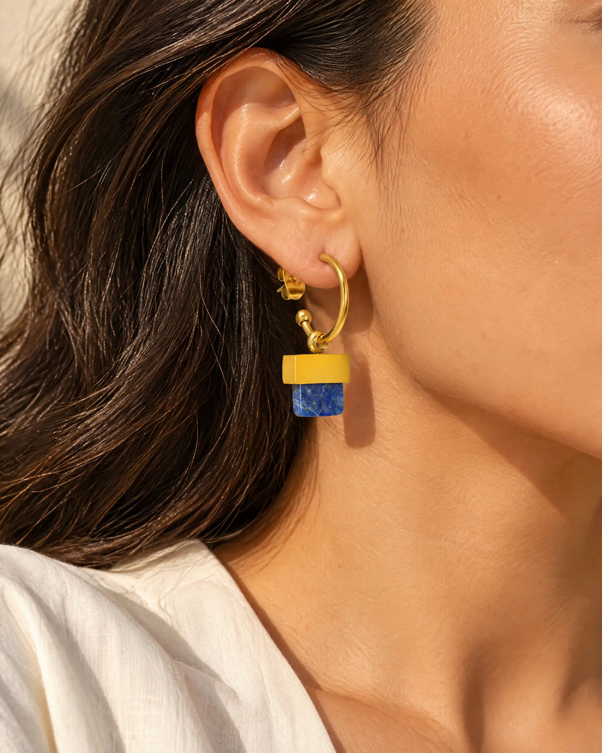 Stepped Horizon Hoop Earrings three-quarter ear worn view