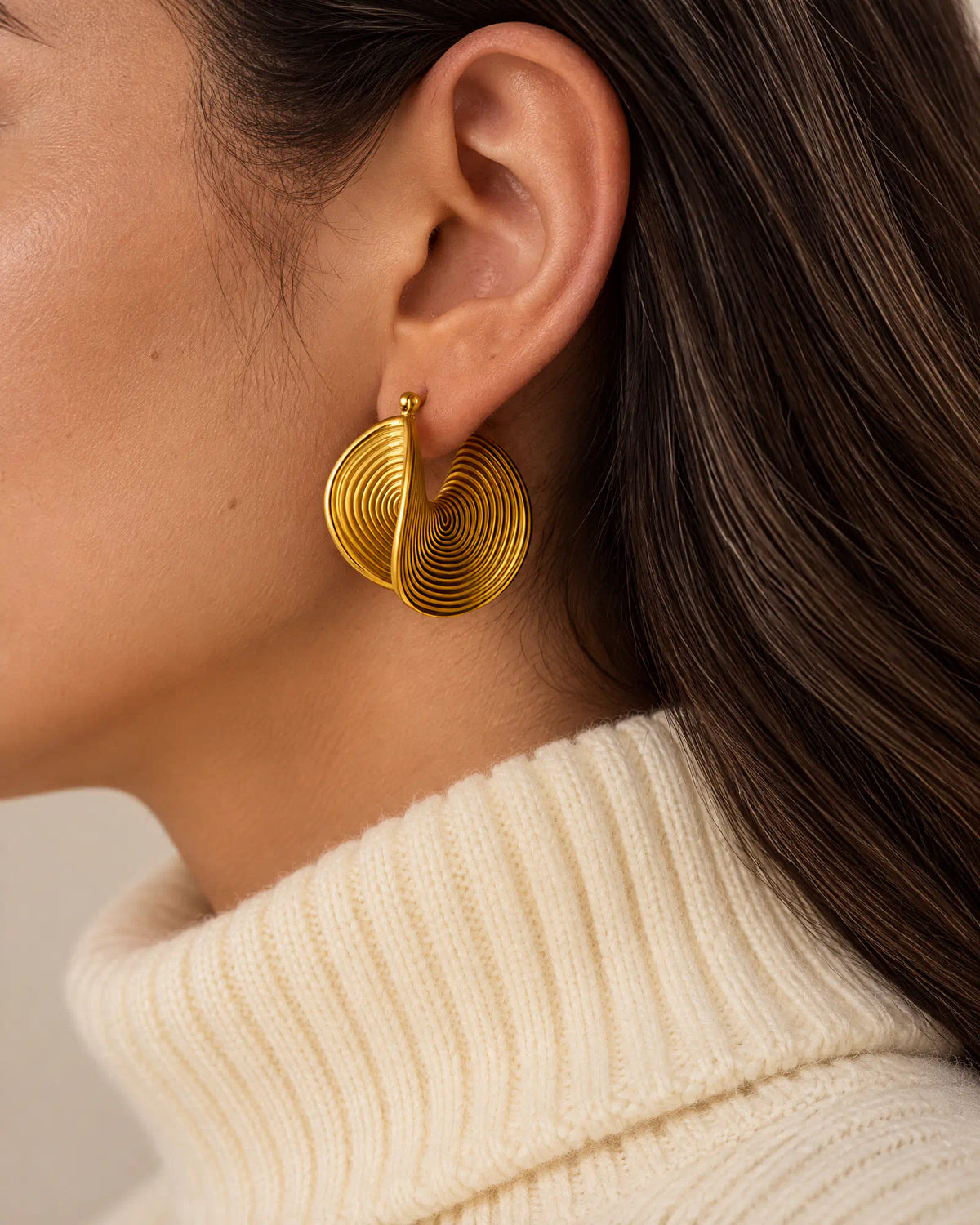 Spiral Twist Statement Earrings worn on ear in profile