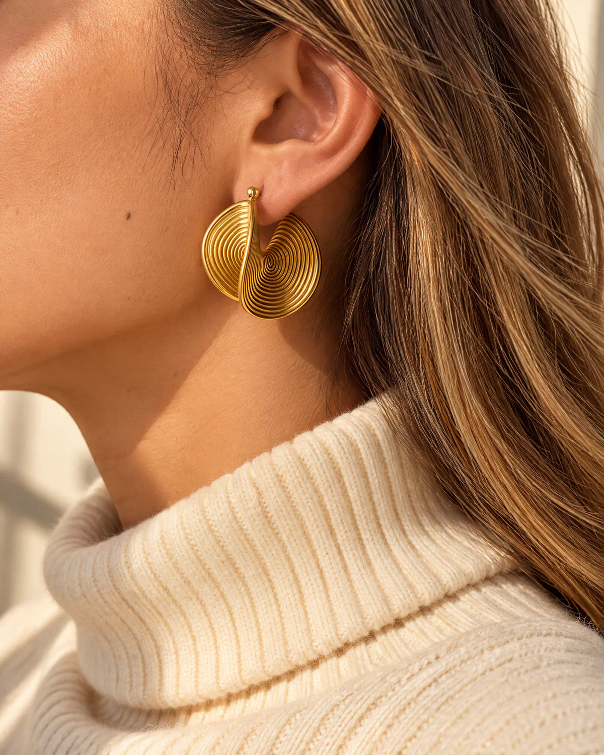 Fall outfit styling with cream turtleneck sweater and Spiral Twist Statement Earrings
