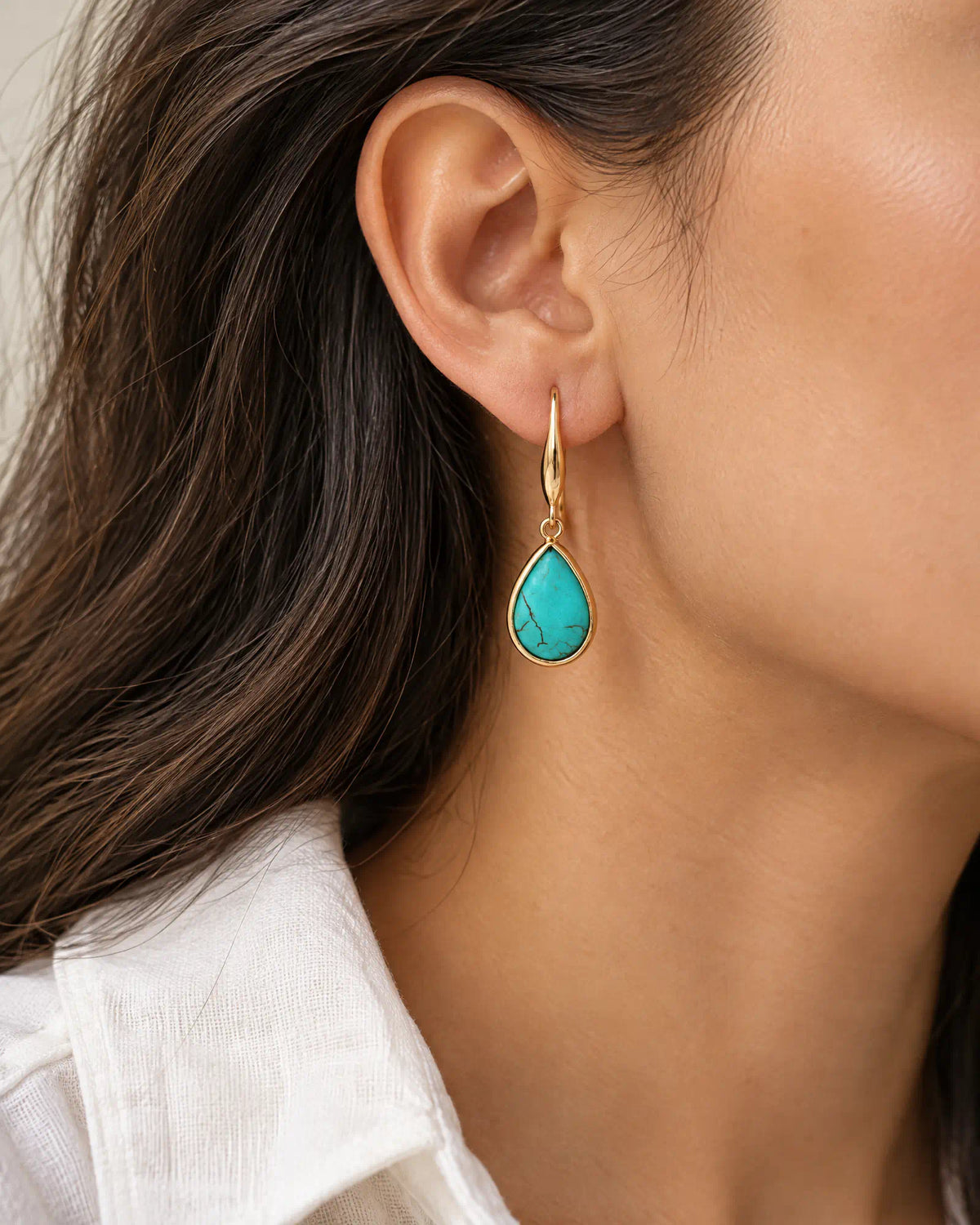Coastal Teardrop Drop Earrings worn on ear profile