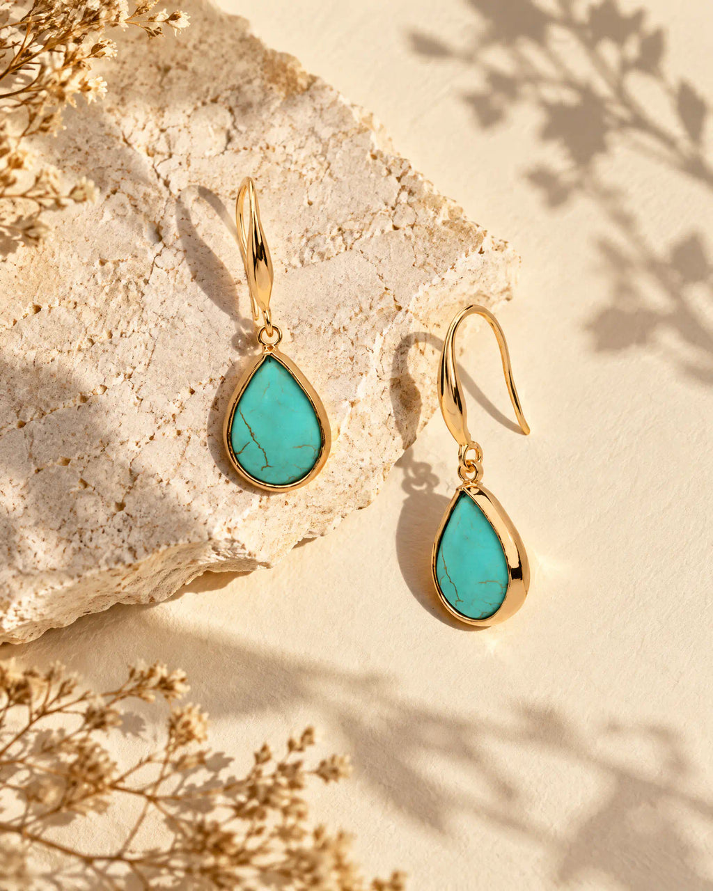 Coastal Teardrop Drop Earrings resting on natural limestone