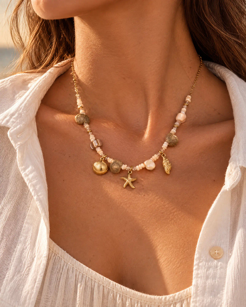Summer lifestyle styling of Shoreline Starfish Charm Necklace with linen attire