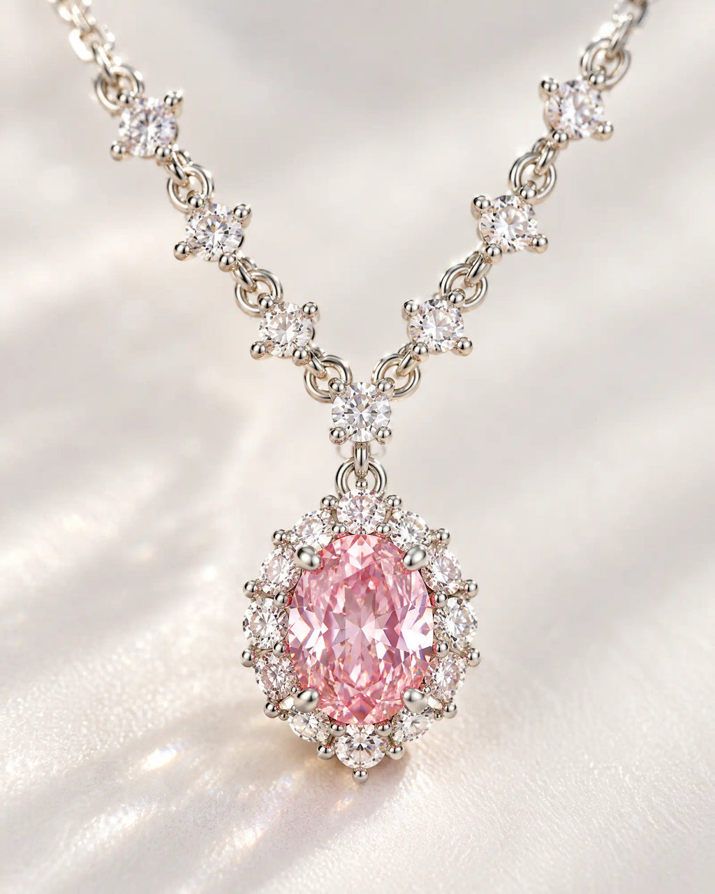 Wearlumi Blush Oval Halo Necklace macro detail of pink faceted centerpiece and halo stones