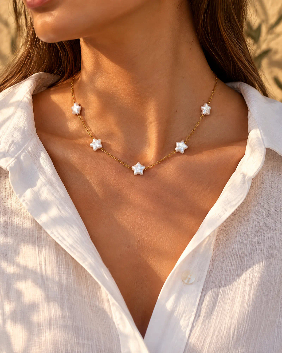 Starlight Station Necklace worn with an open white shirt
