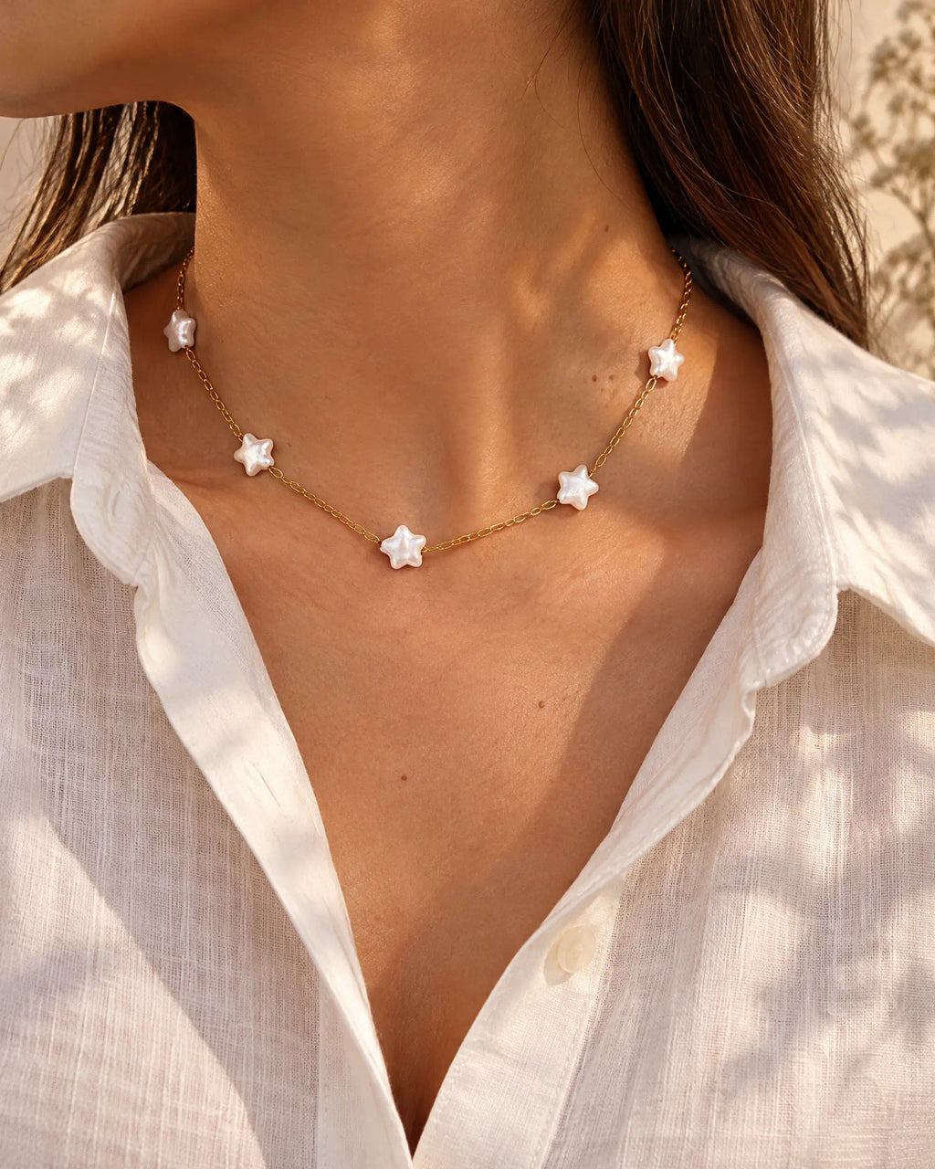 Three-quarter view of the Starlight Station Necklace on the neck
